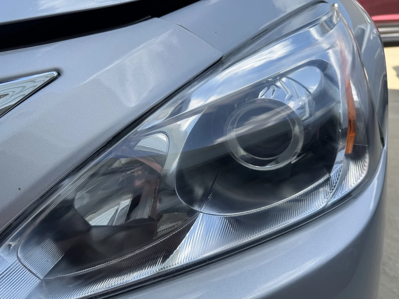 Finished headlight detail on a 2015 Nissan Altima in north Freeport