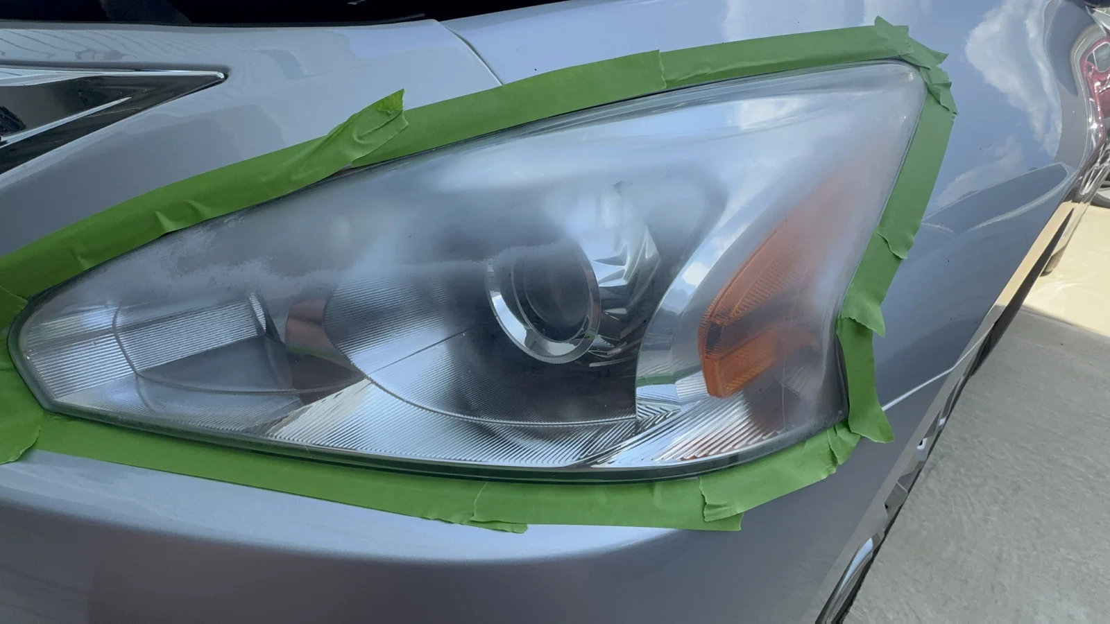 2015 Nissan Altima headlight masked during restoration prep in north Freeport
